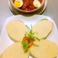 Boiled Yam with Garden Egg Sauce Garnished with Eggs
